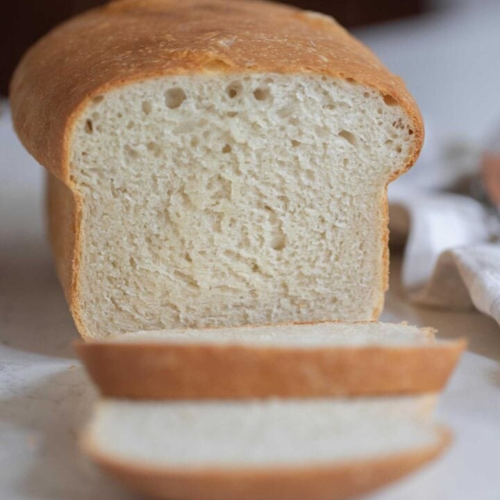 the side of a loaf of bread with two slices sliced off