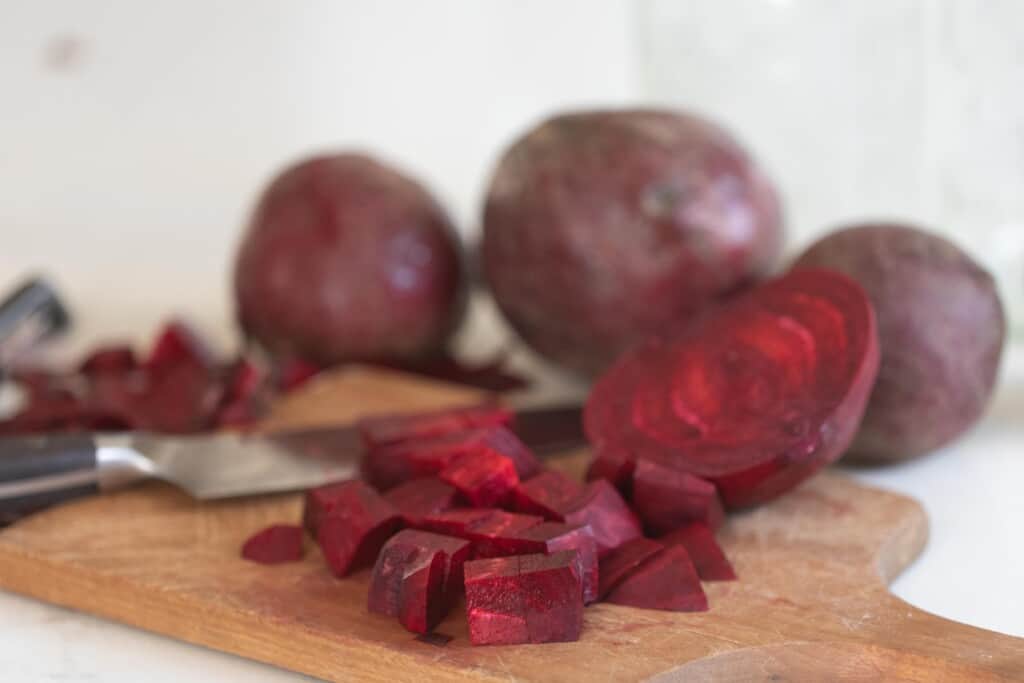 beets sliced on a wood cutting board