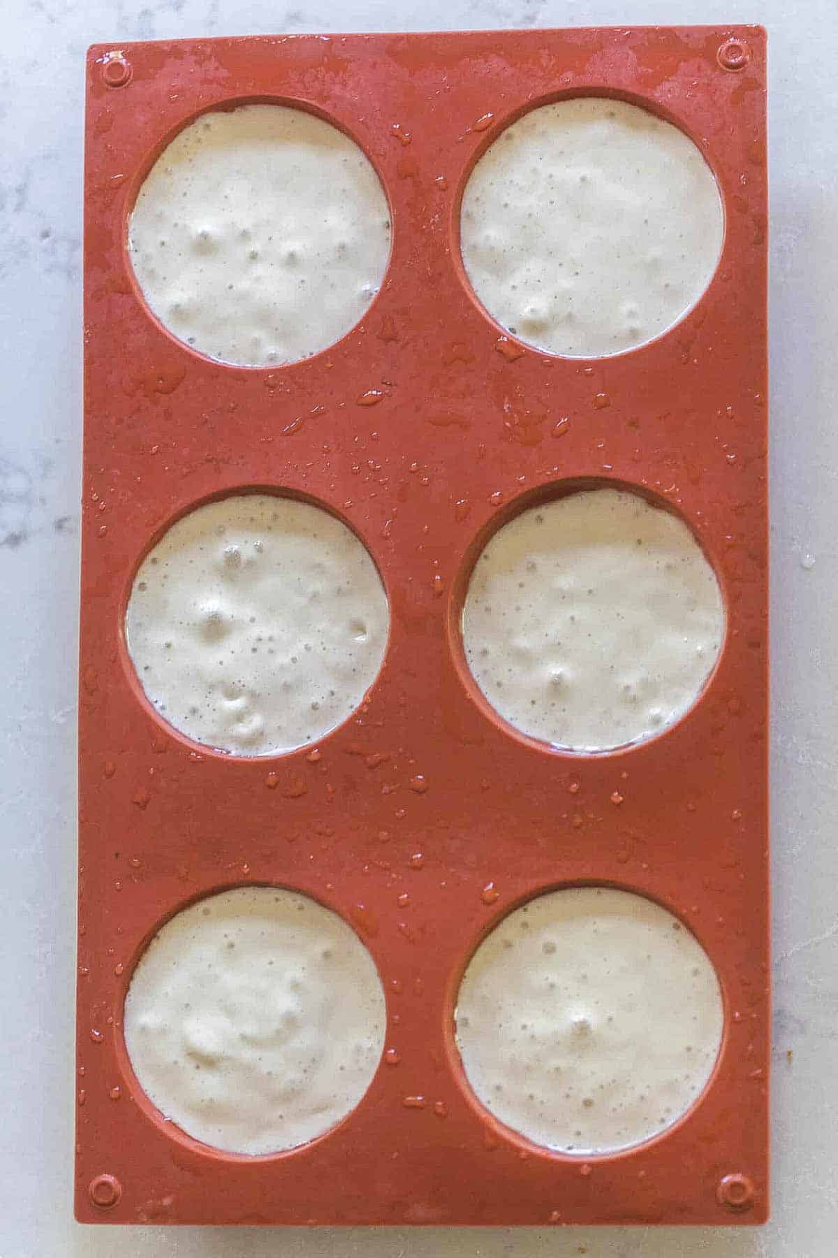 sourdough starter in silicon muffin pan.