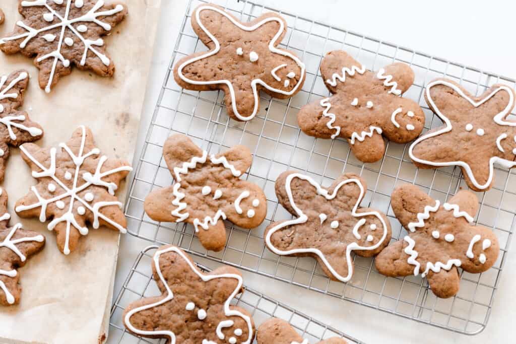 sourdough gingerbread cookie men decorated on a wire rack