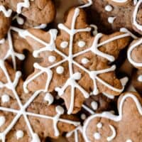 overhead photo of decorated sourdough gingerbread cookies of different shapes and sizes