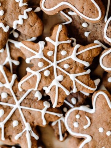 overhead photo of decorated sourdough gingerbread cookies of different shapes and sizes