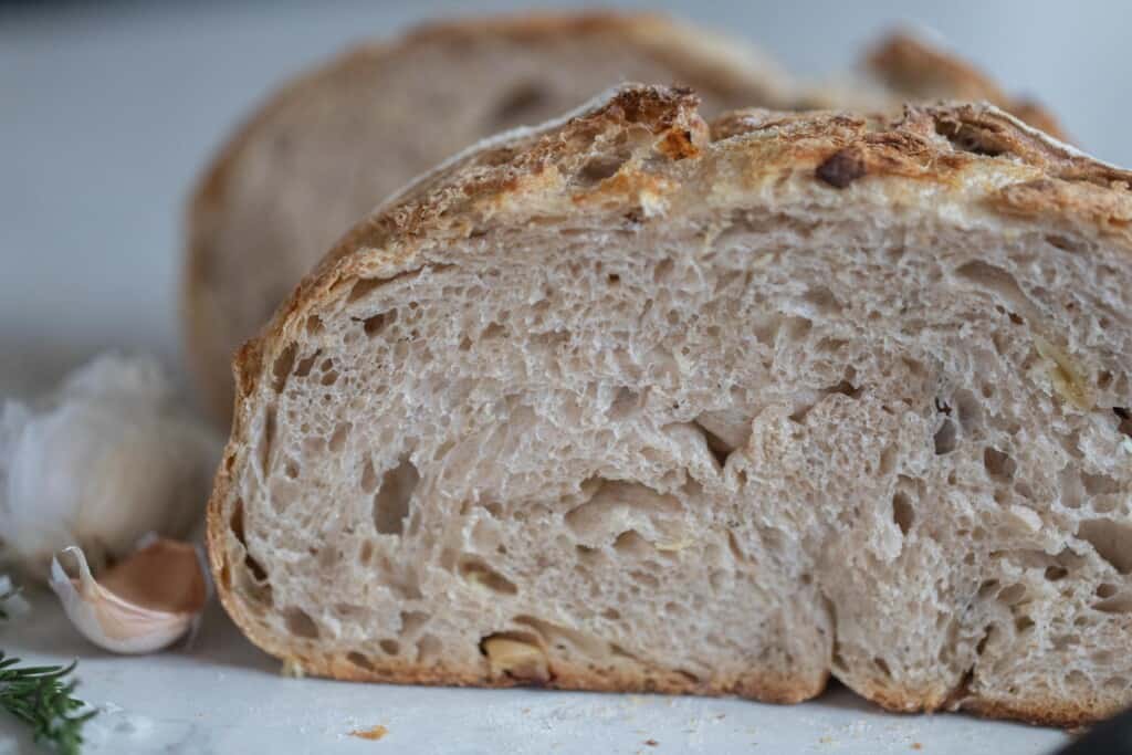 garlic sourdough bread loaf cut in half