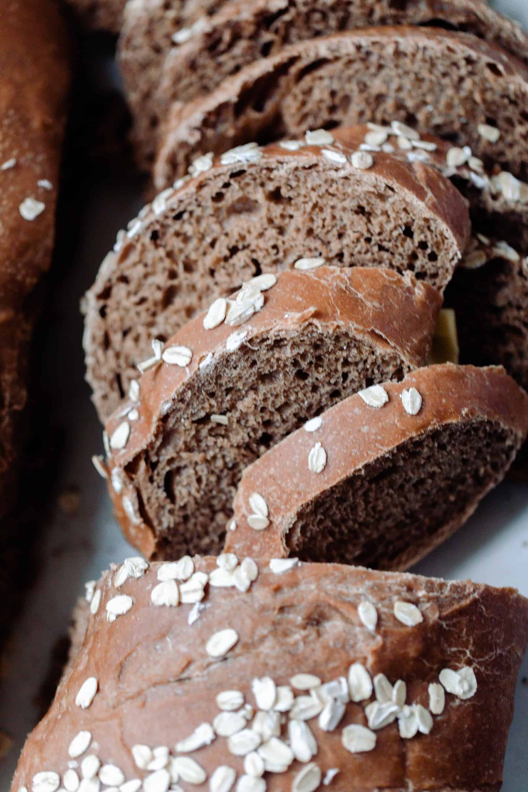 loaf of sourdough brown bread cut into slices