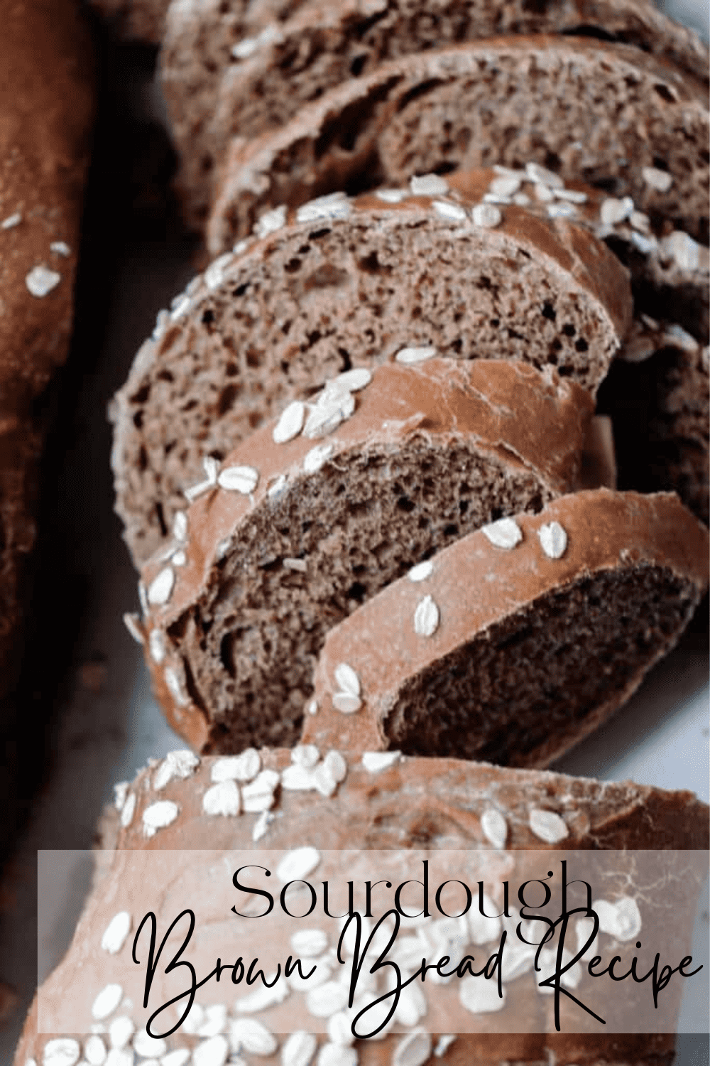 A sliced loaf of sourdough brown bread 