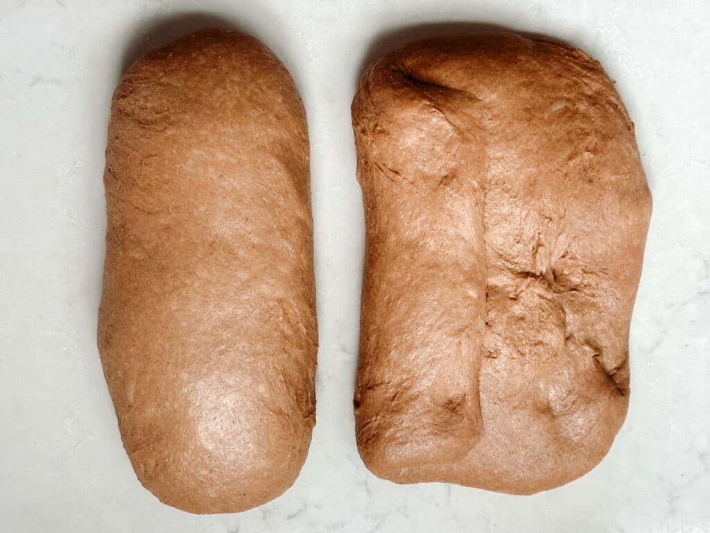 shaping sourdough brown bread dough on a white countertop