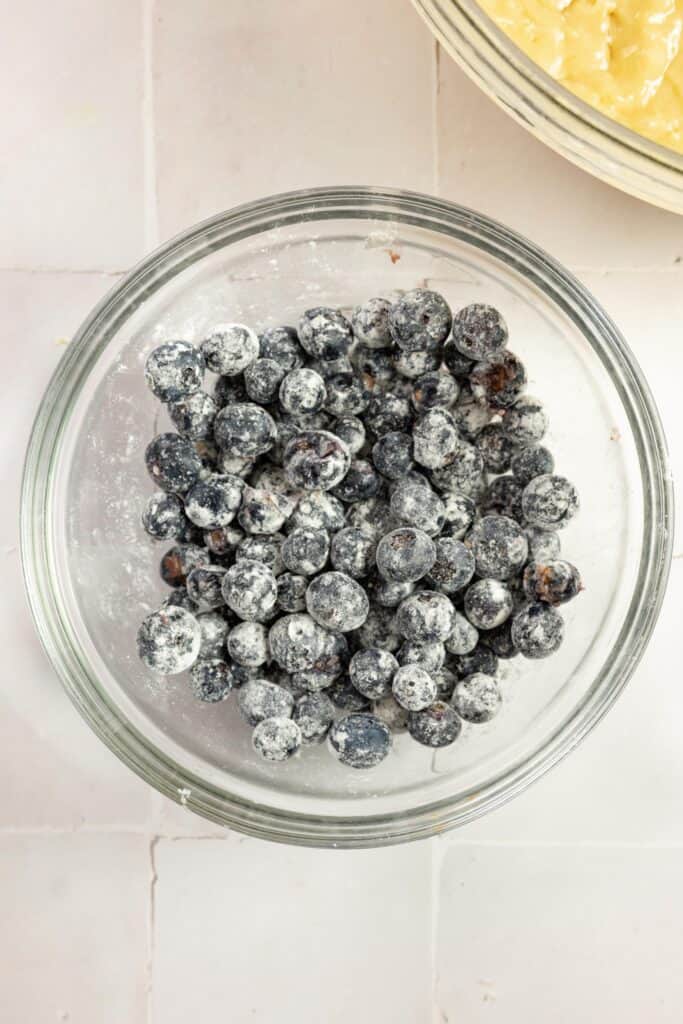 A small bowl of blueberries coated in all purpose flour