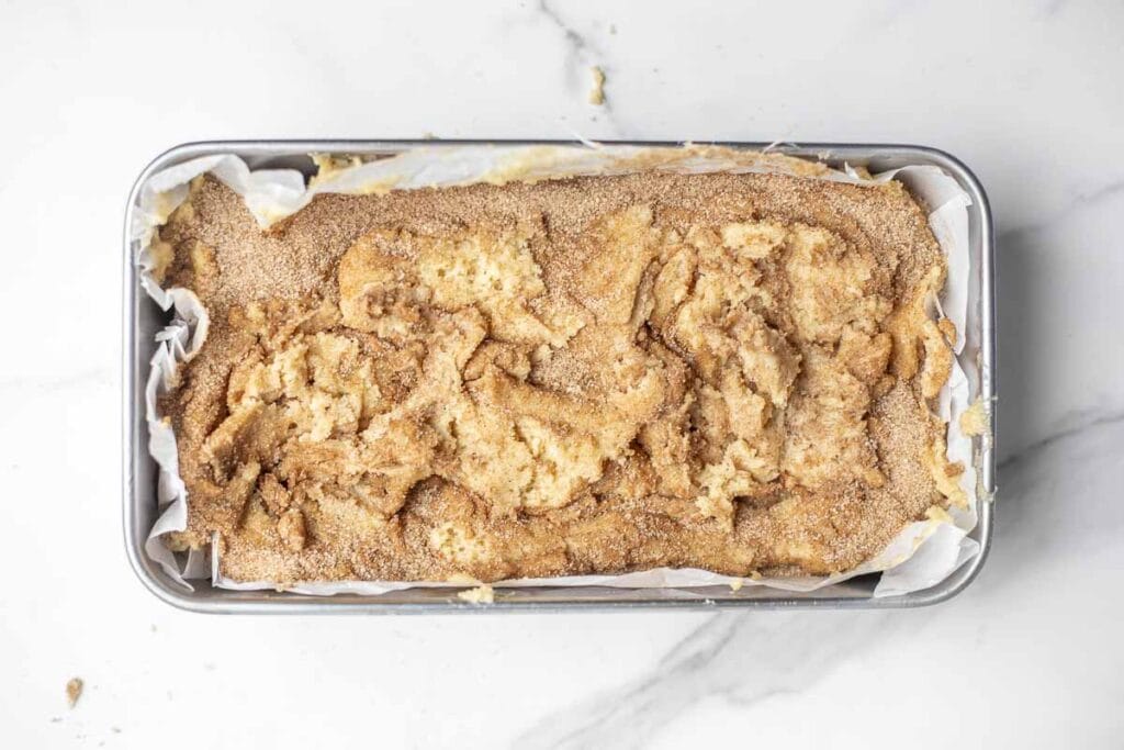 sourdough cinnamon bread in a loaf pan ready for the oven 