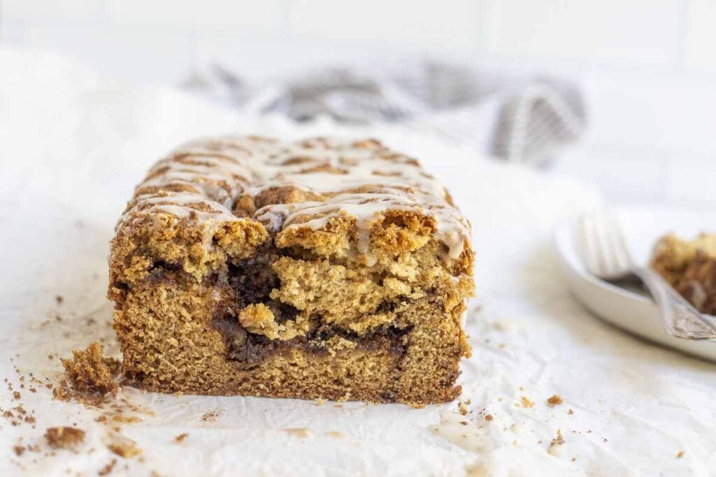 side view off sourdough cinnamon swirl quick bread on a white countertop