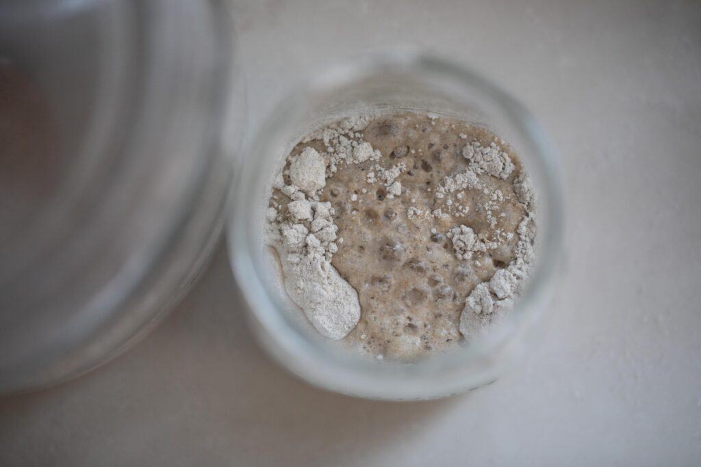 flour and rye flour mixed together in a glass jar