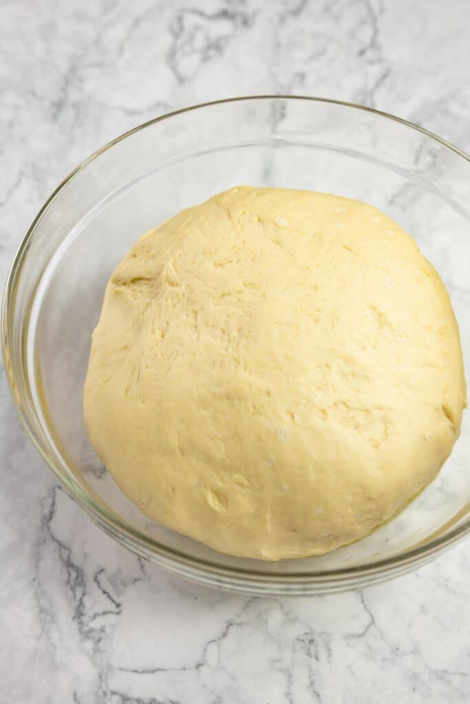 smooth dough in a glass bowl