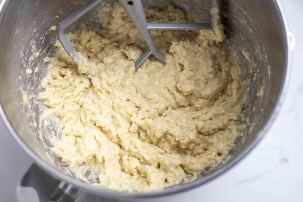 batter mixed in a stainless steel bowl with a paddle attachment