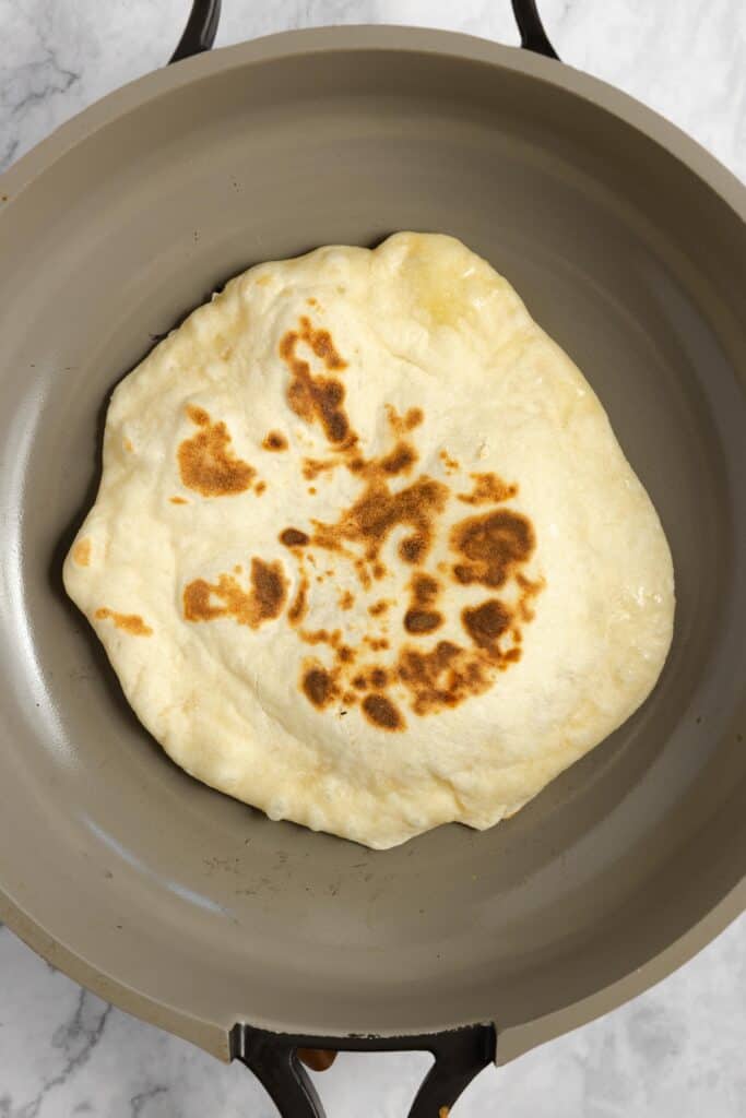 sourdough nan cooking in a non stick skillet