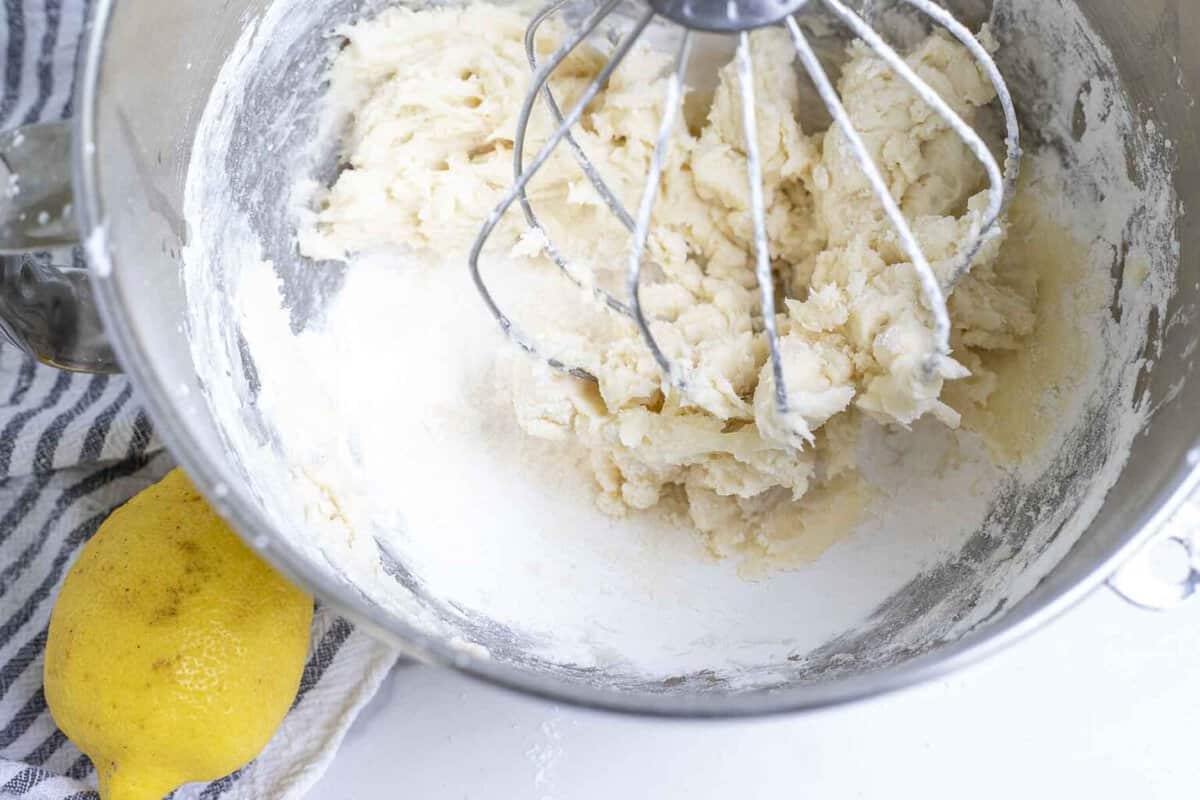 Lemon frosting mixed together in a stand mixer