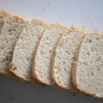 Slices of pain de mie bread layered in a horizontal line