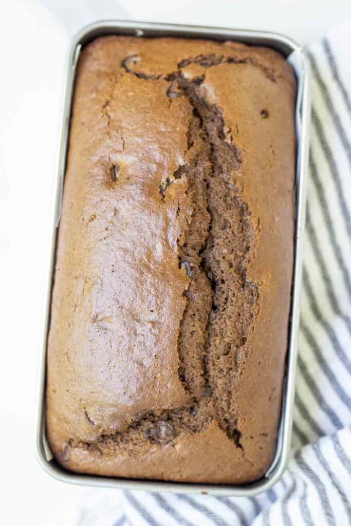 overhead photo of a loaf of sourdough chocolate quick bread