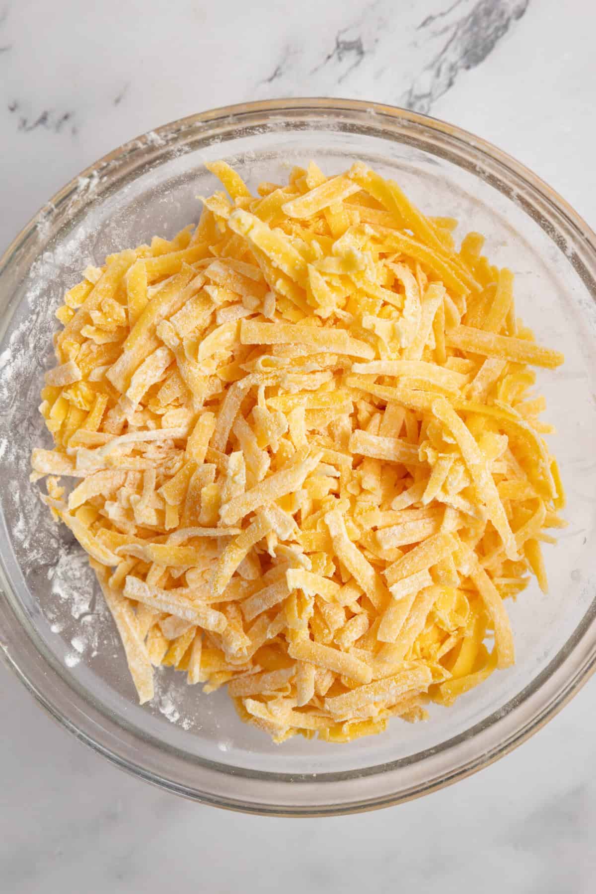 shredded cheddar cheese with cornstarch.