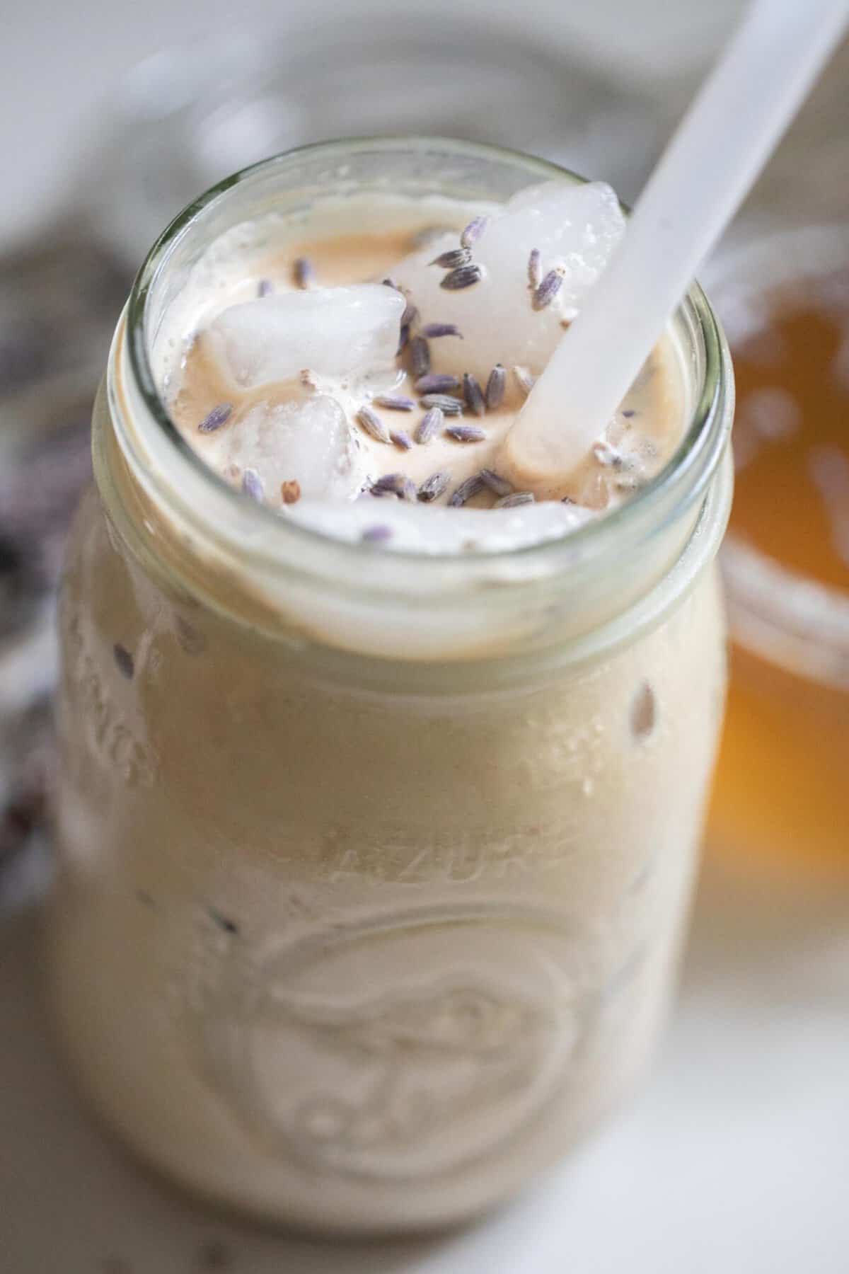 Iced lavender latte in a mason jar.
