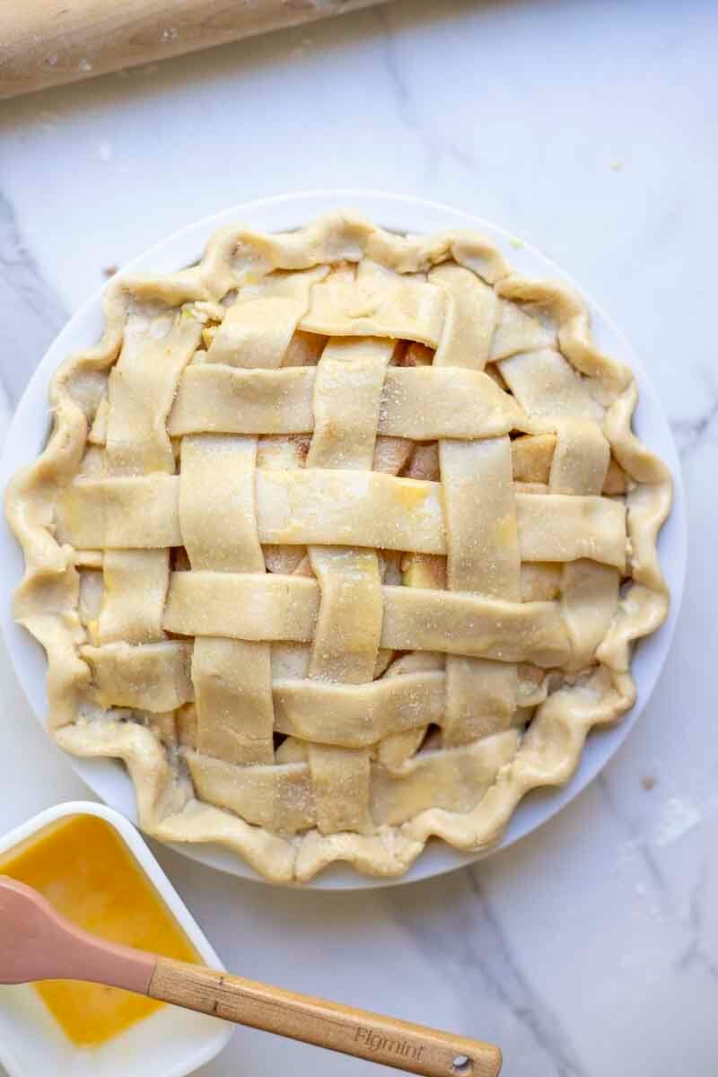apple pie brushed with an egg wash and topped with sugar.