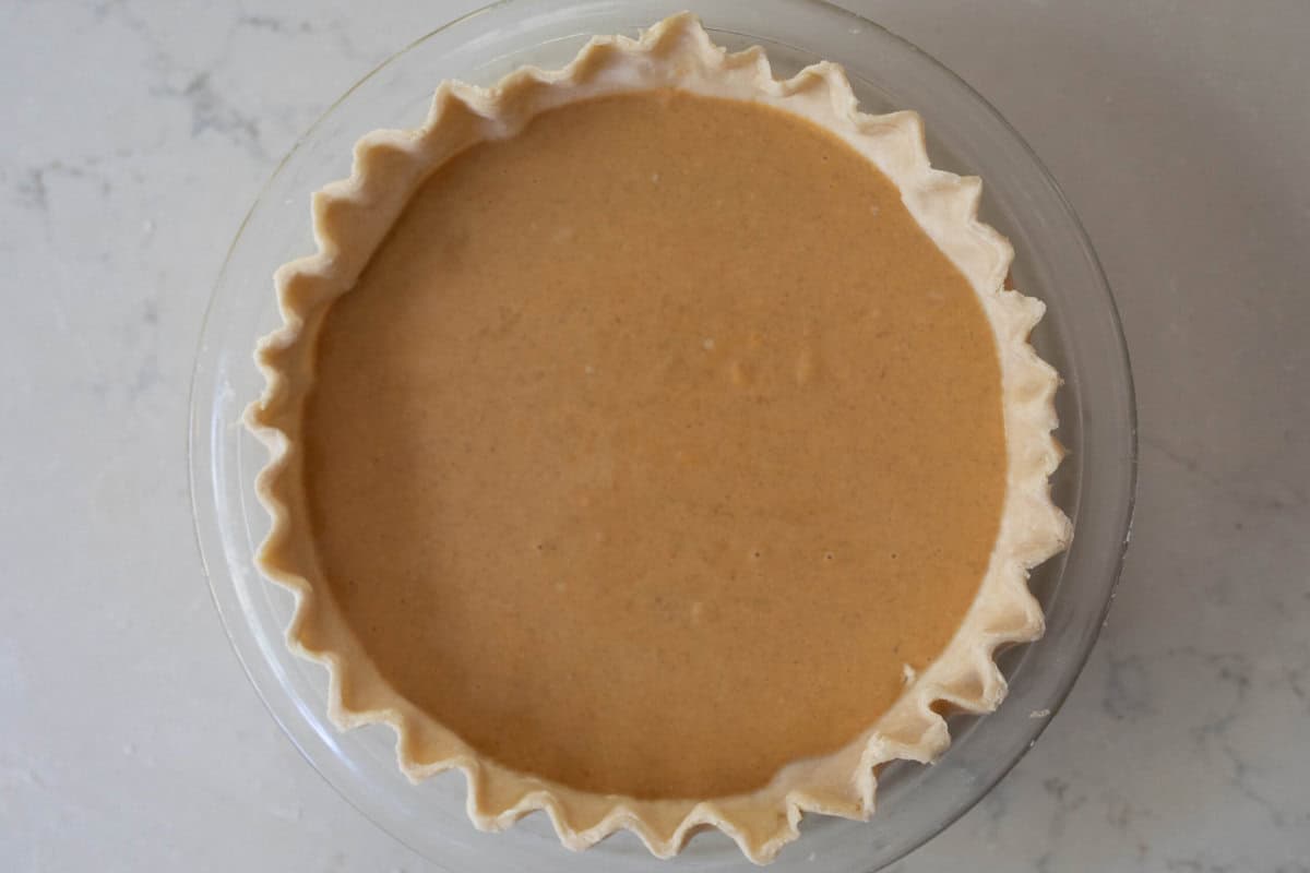 Pumpkin pie ready for the oven.