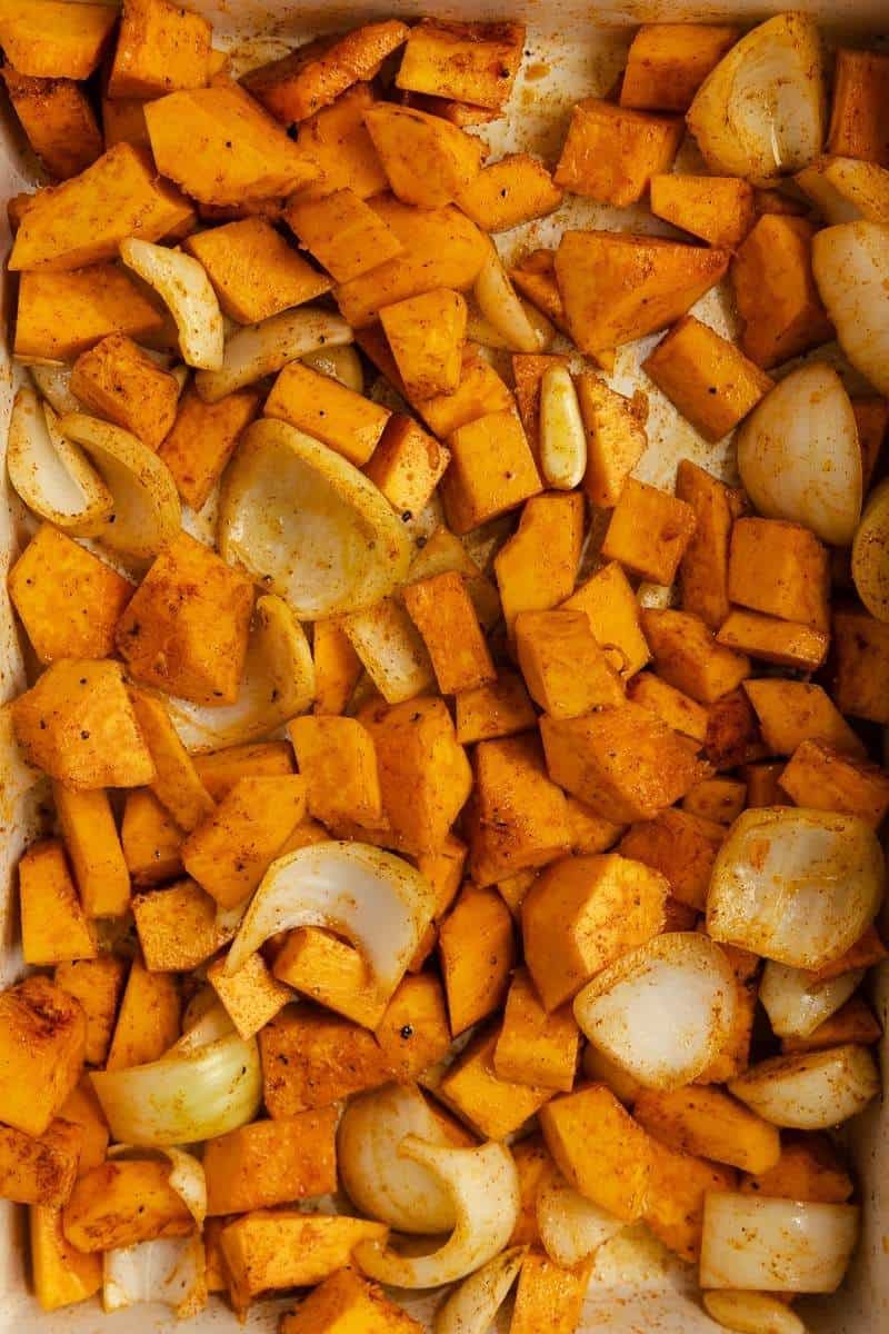 Onion and pumpkin chunks mixed with spices and oil.