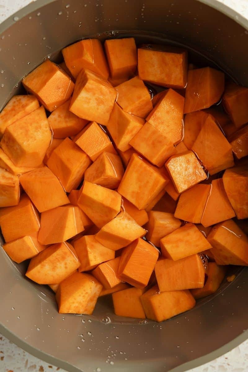 Cubed sweet potatoes in a large pot.