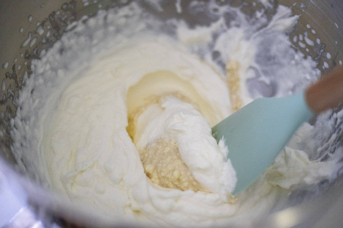Crepe filling mixed together in a bowl with a spatula. 