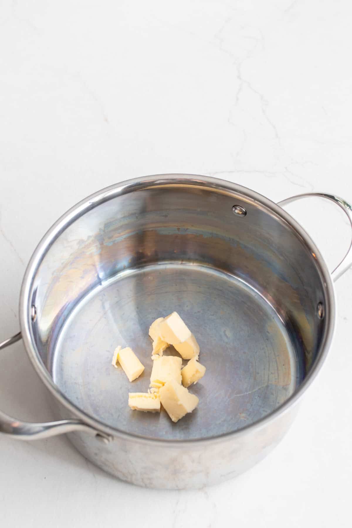 Cubes of butter in a large stock pot.