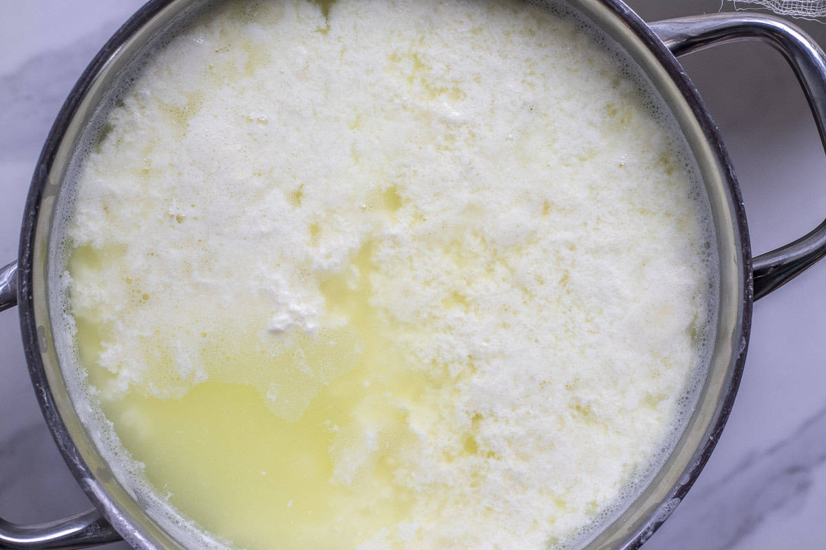 Finished farmers cheese on cheesecloth.