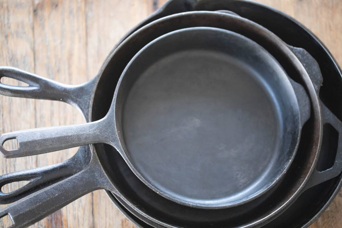 Cast iron skillets stacked inside each other.