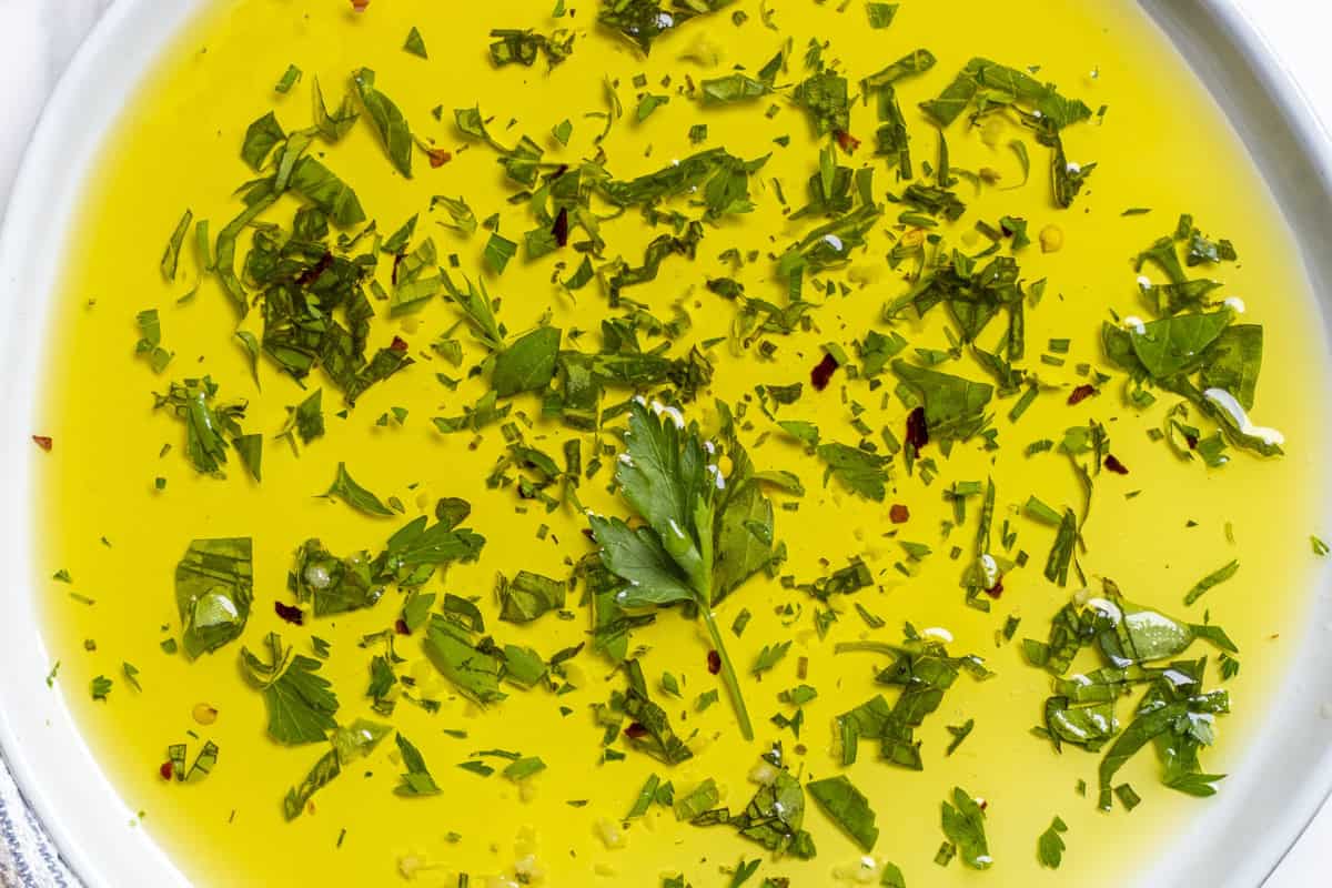Herbs in a bowl of oil.