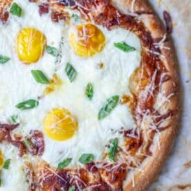 Half of a baked breakfast pizza.