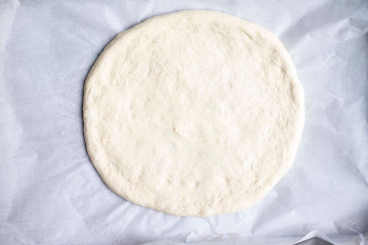 Dough rolled into a circle.