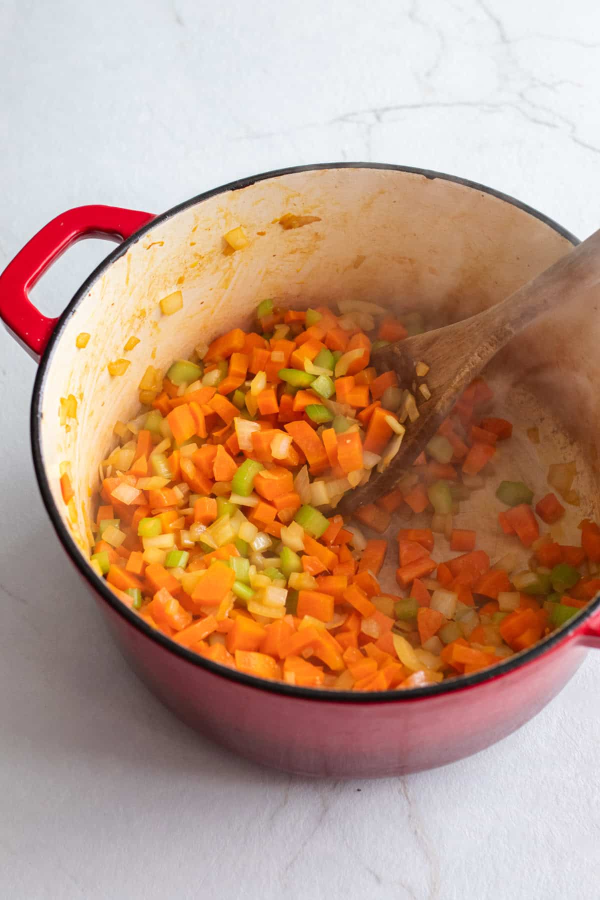 Sautéing vegetables in a dutch oven.
