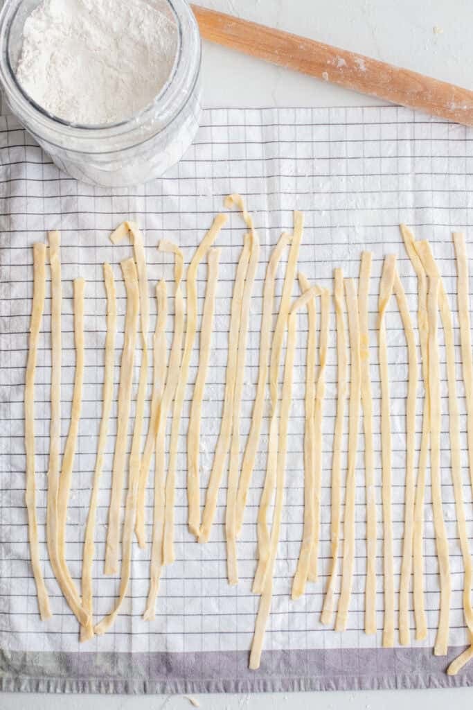Sourdough pasta drying on a towel. 