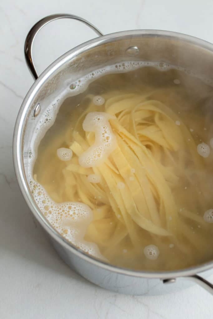 Pasta in a large pot of boiling water.
