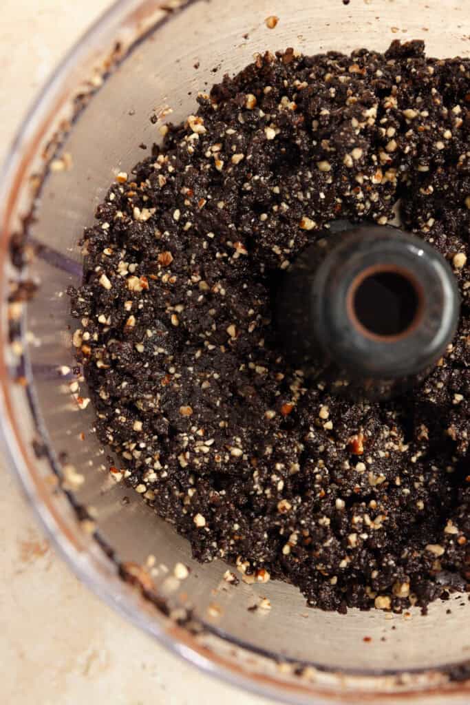 Dates, pecans, coconut oil, salt and cocoa powder blended in a stand mixer.