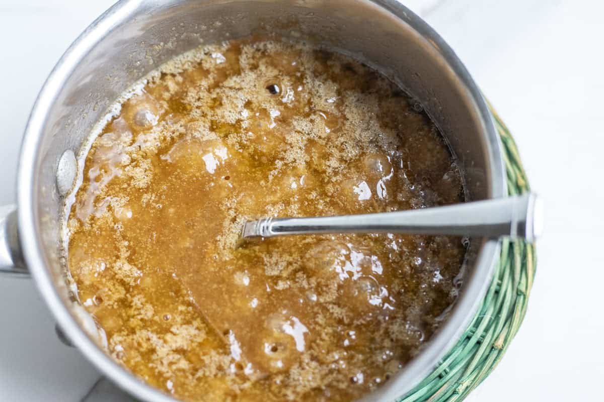  making brown sugar butter sauce in a sauceapan.