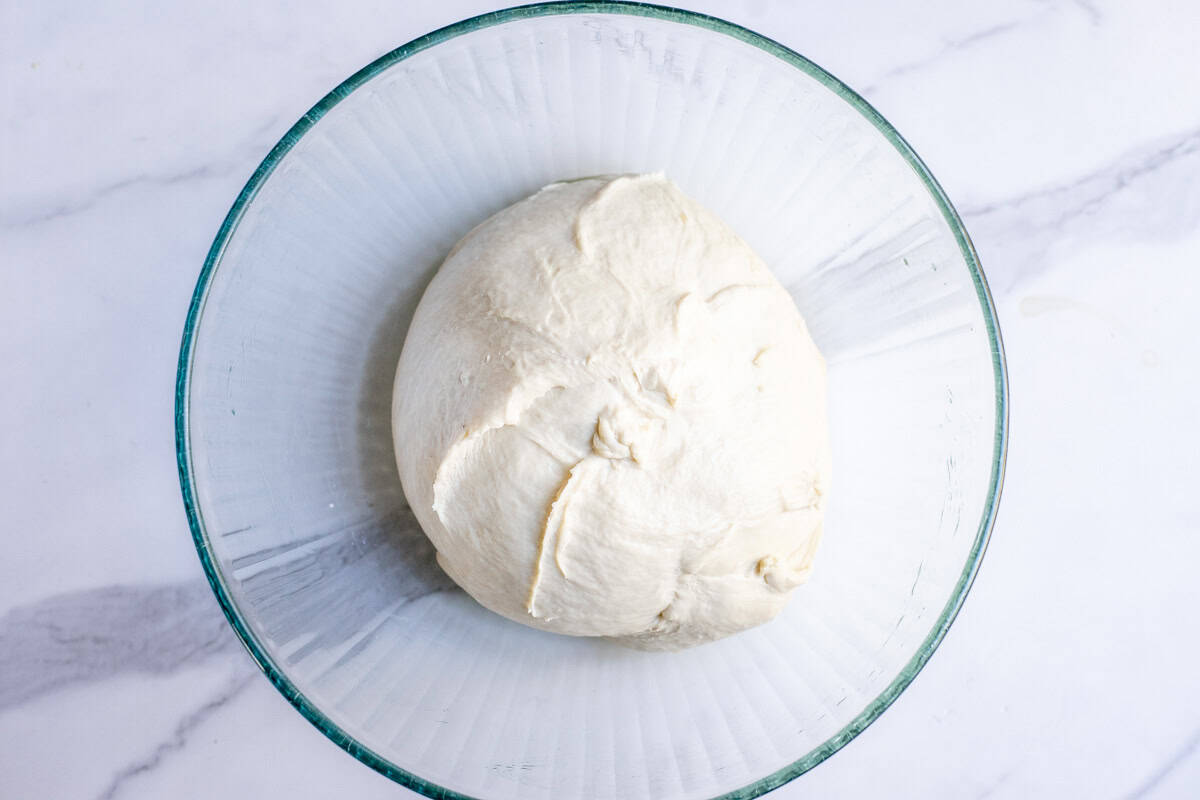 dough in a greased bowl.