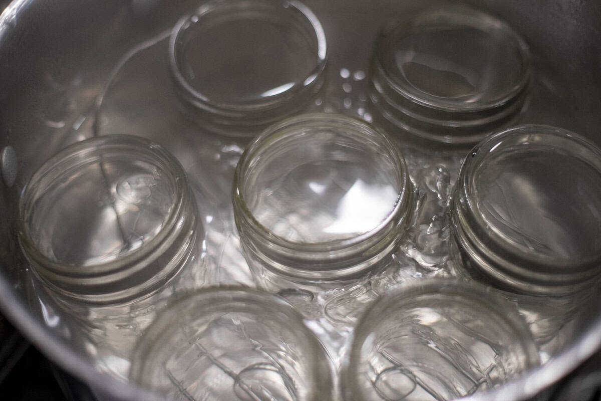 Jars in a pot of water.