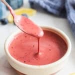 Blueberry Vinaigrette in a small bowl with a spoon taking some out.