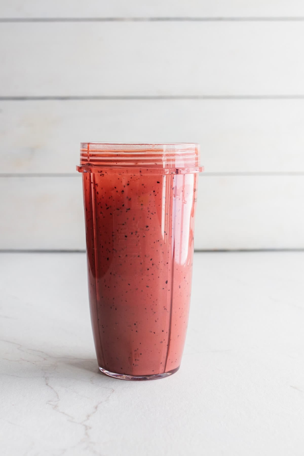 Blueberry salad dressing in a blender blended up.