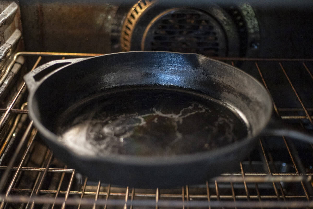 Cast iron skillet in an oven.