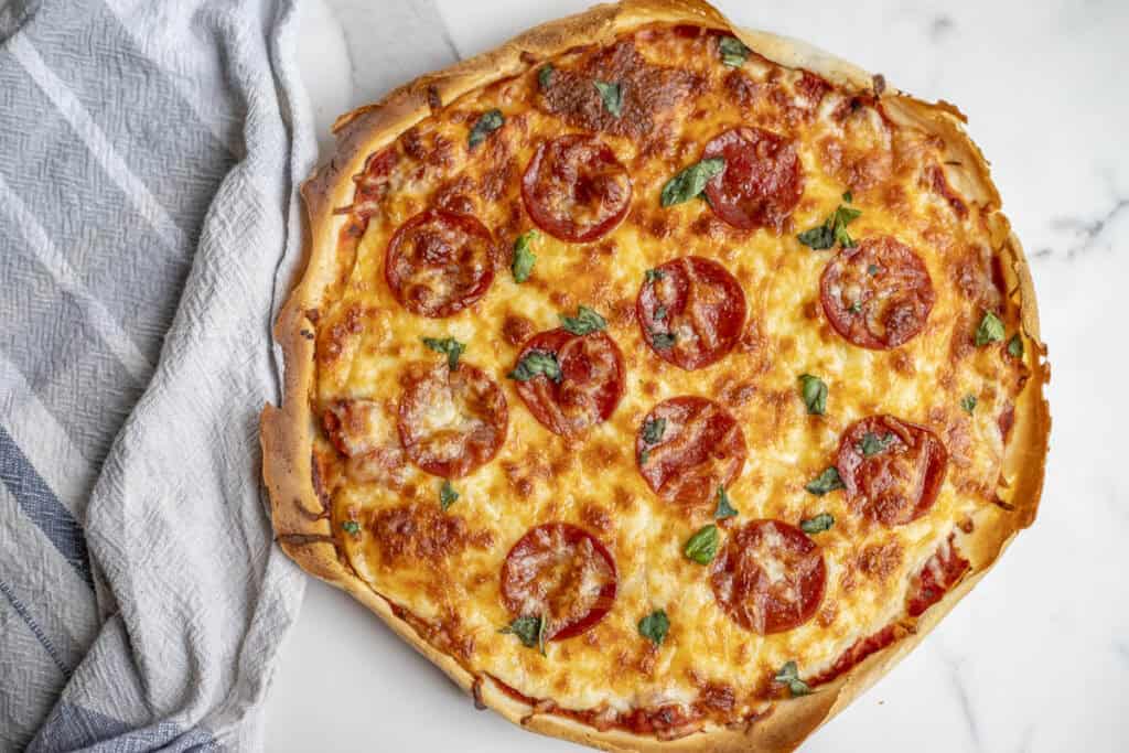 A pepperoni pizza with a sourdough discard crust.
