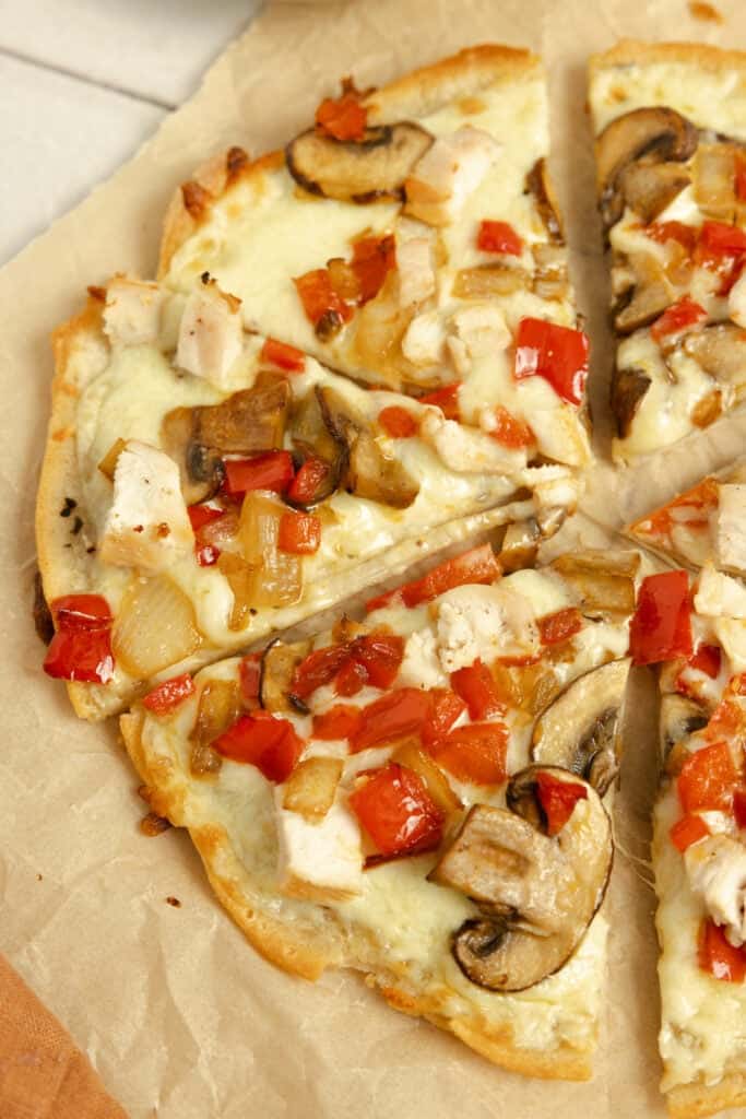 Half of an alfredo pizza.
