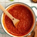 tomato sauce cooking in a pot.