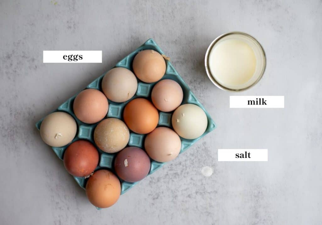 Milk, eggs, and salt on a countertop.