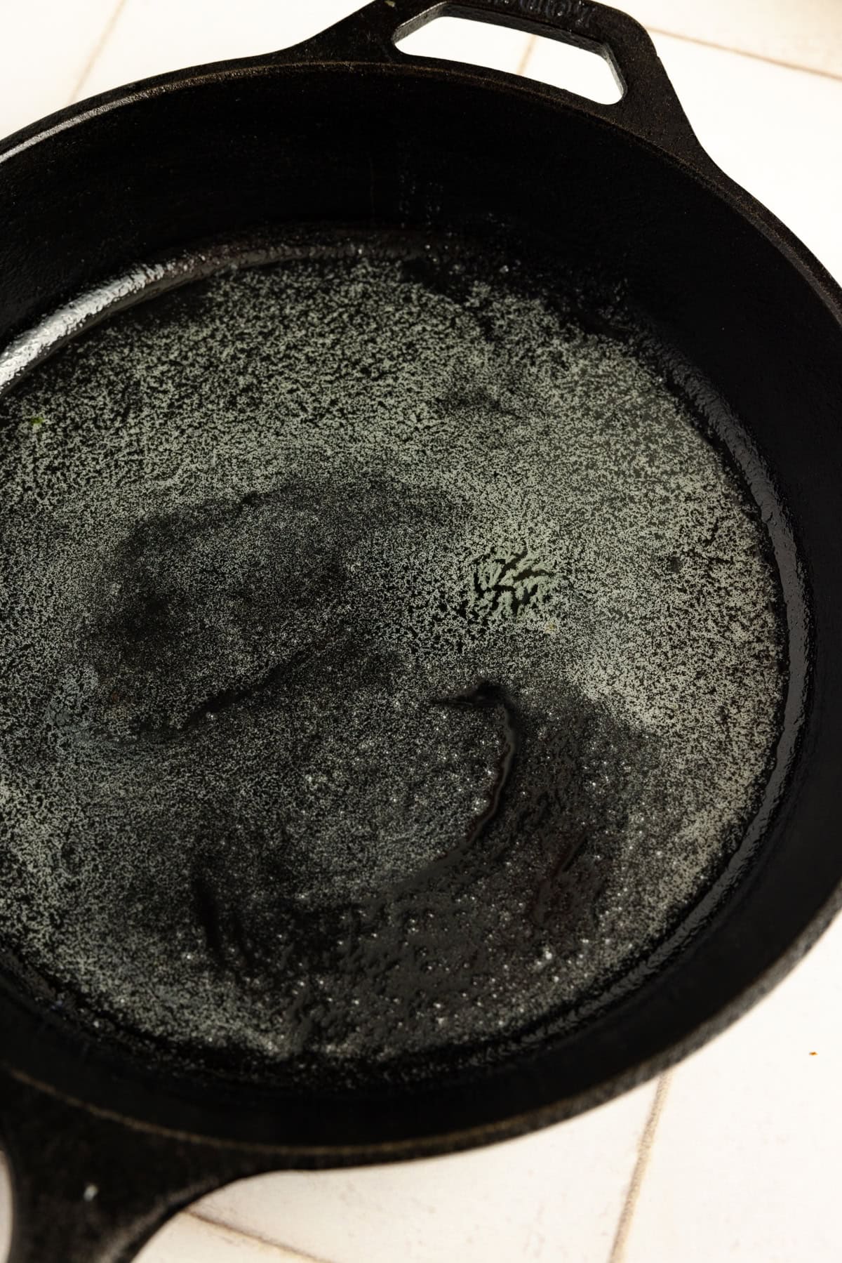 Melted butter in a cast iron skillet.