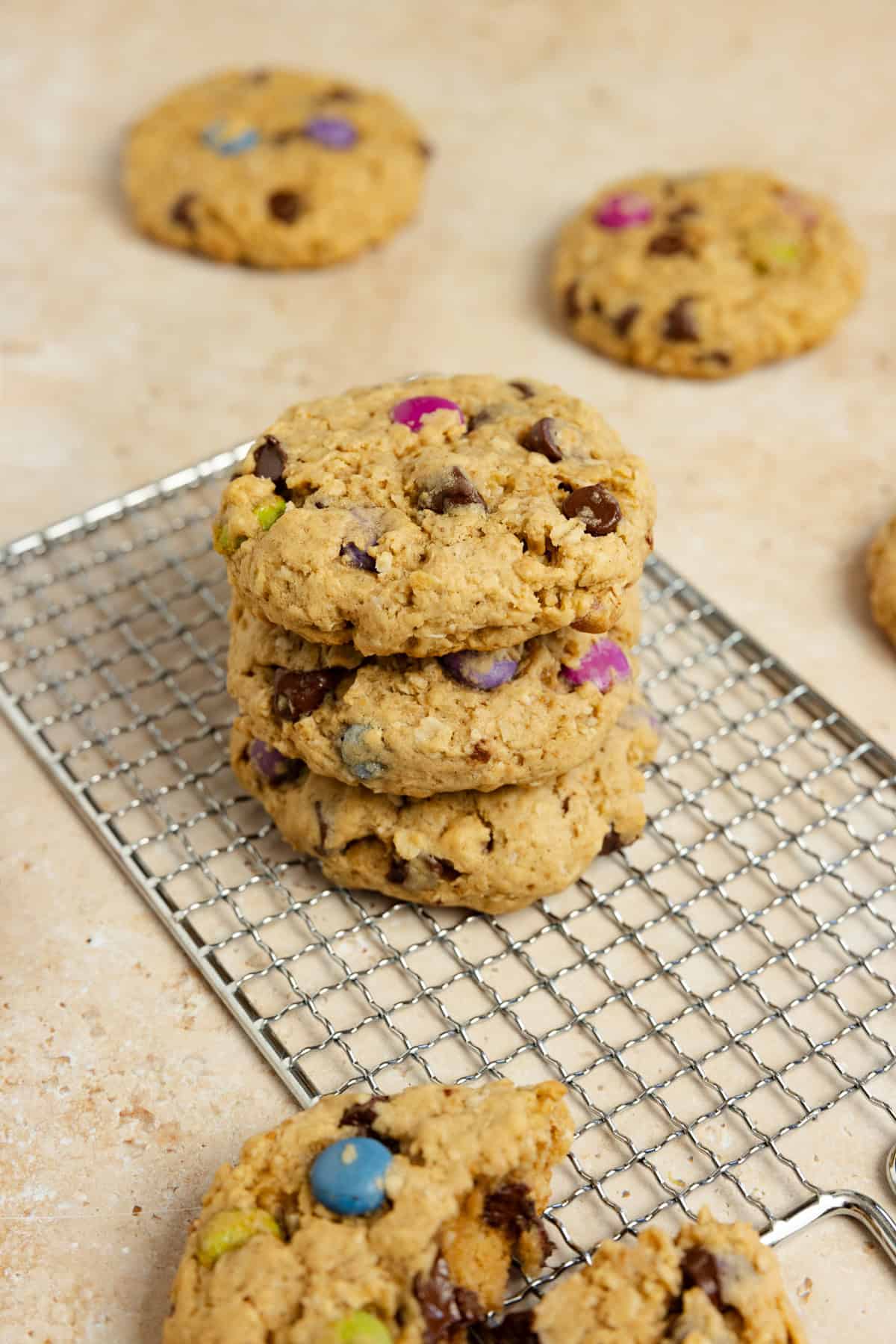 Cookies stacked on a cooling rack.