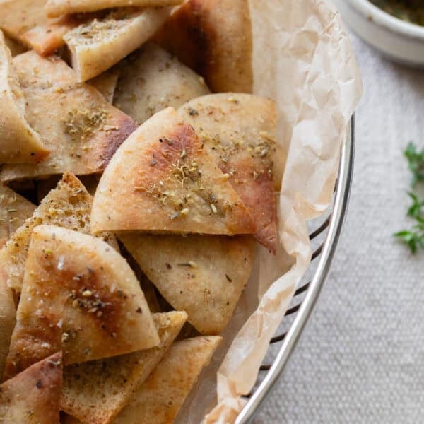 sourdough pita chips layered in a bowl.